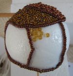 glue on seed beads ont he ball