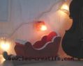 Illuminated Christmas garland with decopatch designs